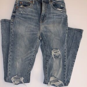 Distressed Boot Cut Jeans in Classic Blue